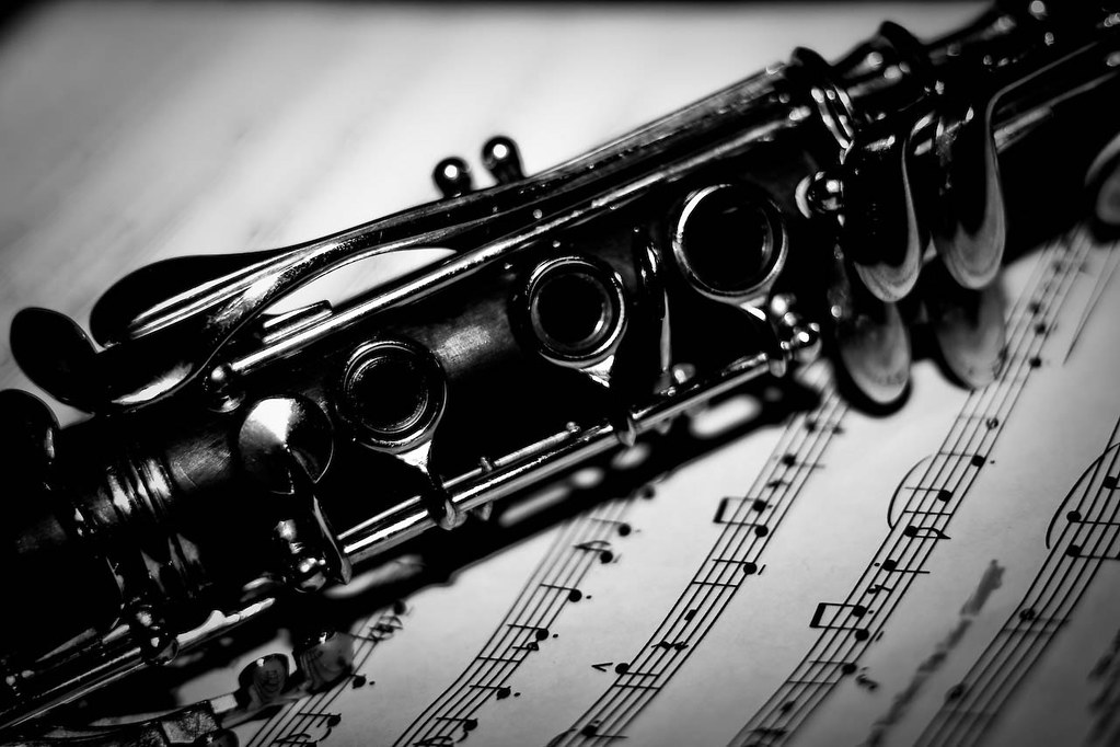 A clarinet resting on a sheet of music